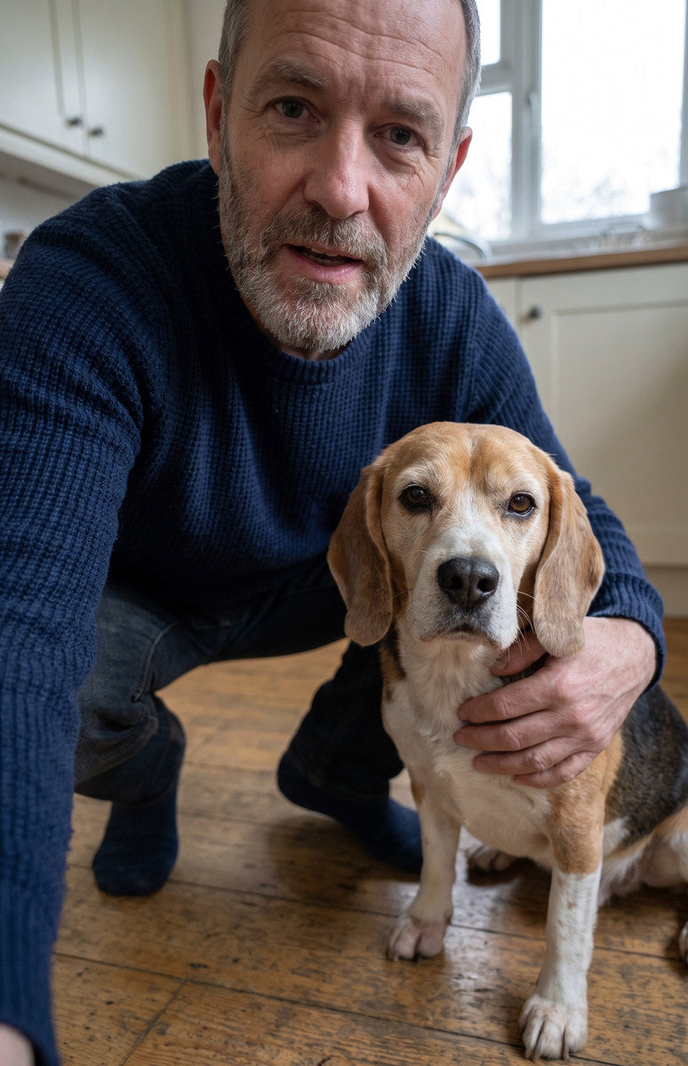 An owner in his kitchen with his beagle